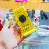 MRD Pro Vector foil shaver in gold held in hand in a barbershop