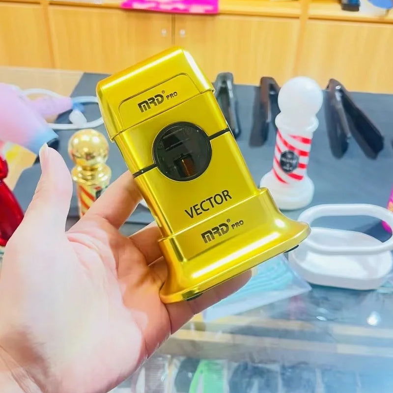 MRD Pro Vector foil shaver in gold held in hand in a barbershop