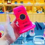 MRD Pro Vector foil shaver in pink held in hand in a barbershop